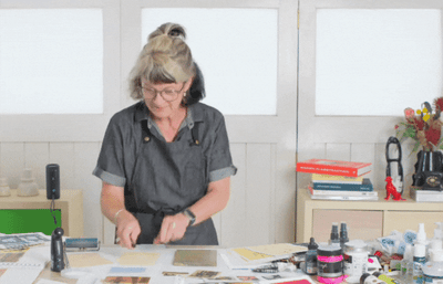 GIF of Tara Axford dancing in her art studio