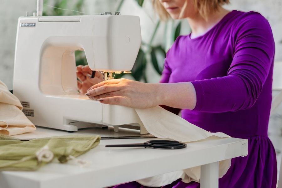 Kelly woman on sewing machine