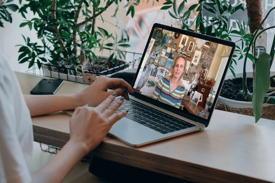 woman on laptop watching q&a
