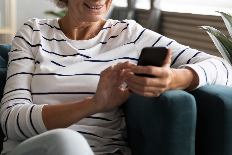 woman on phone smiling